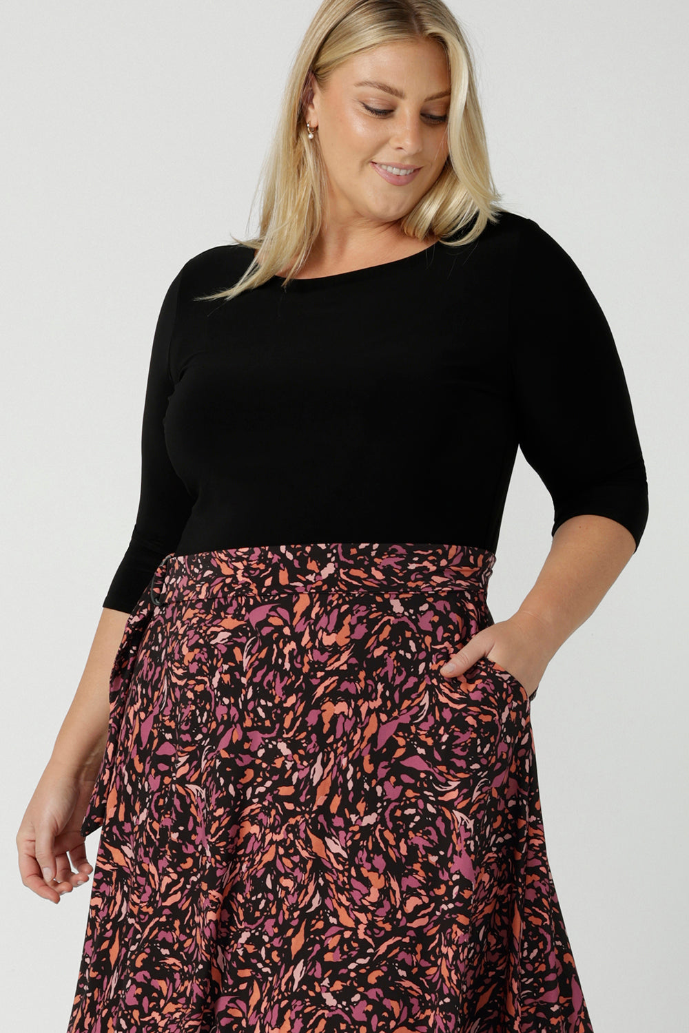 A size 18 woman wears the Melissa Dress in Terrazzo. A jersey dress with a printed skirt and pockets. Jersey dress for petite to plus size women size 8 - 24 made in Australia fashion