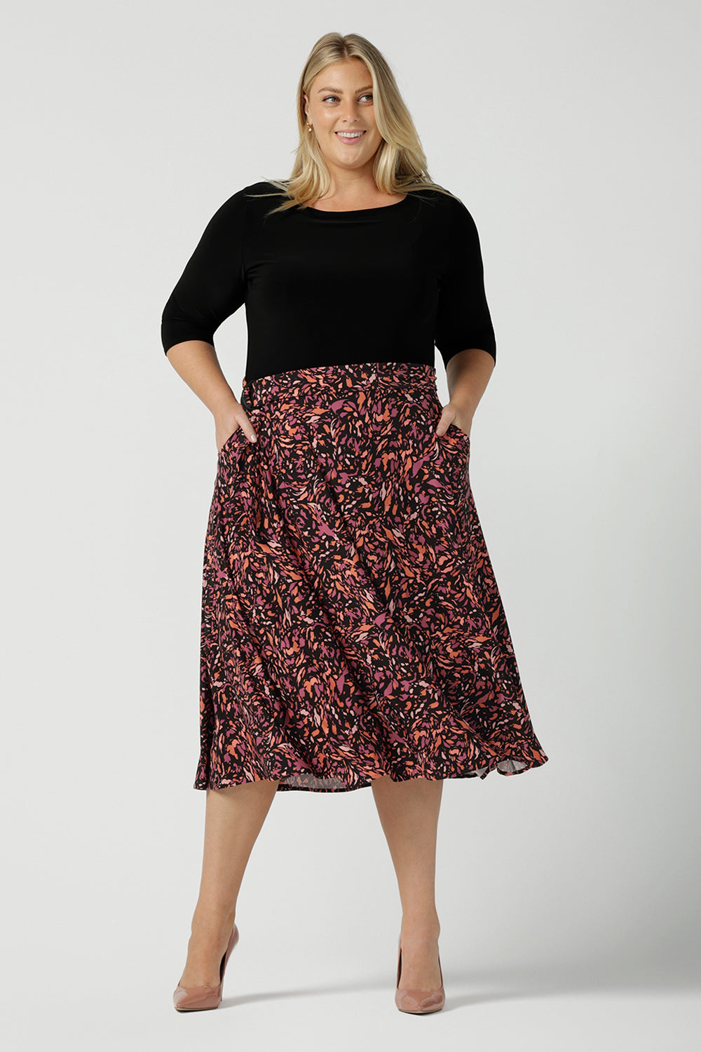 A size 18 woman wears the Melissa Dress in Terrazzo. A jersey dress with a printed skirt and pockets. Jersey dress for petite to plus size women size 8 - 24 made in Australia fashion