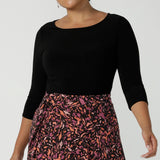 Size 10 woman wears the Melissa Dress in Terrazzo. A jersey dress with a printed skirt and pockets. Jersey dress for petite to plus size women size 8 - 24 made in Australia fashion