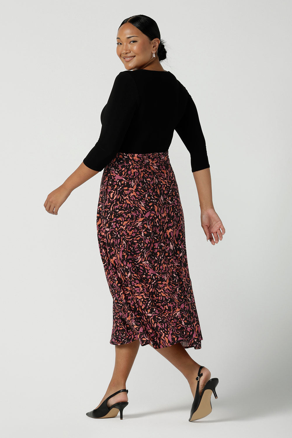 Back view of a size 10 woman wears the Melissa Dress in Terrazzo. A jersey dress with a printed skirt and pockets. Jersey dress for petite to plus size women size 8 - 24 made in Australia fashion