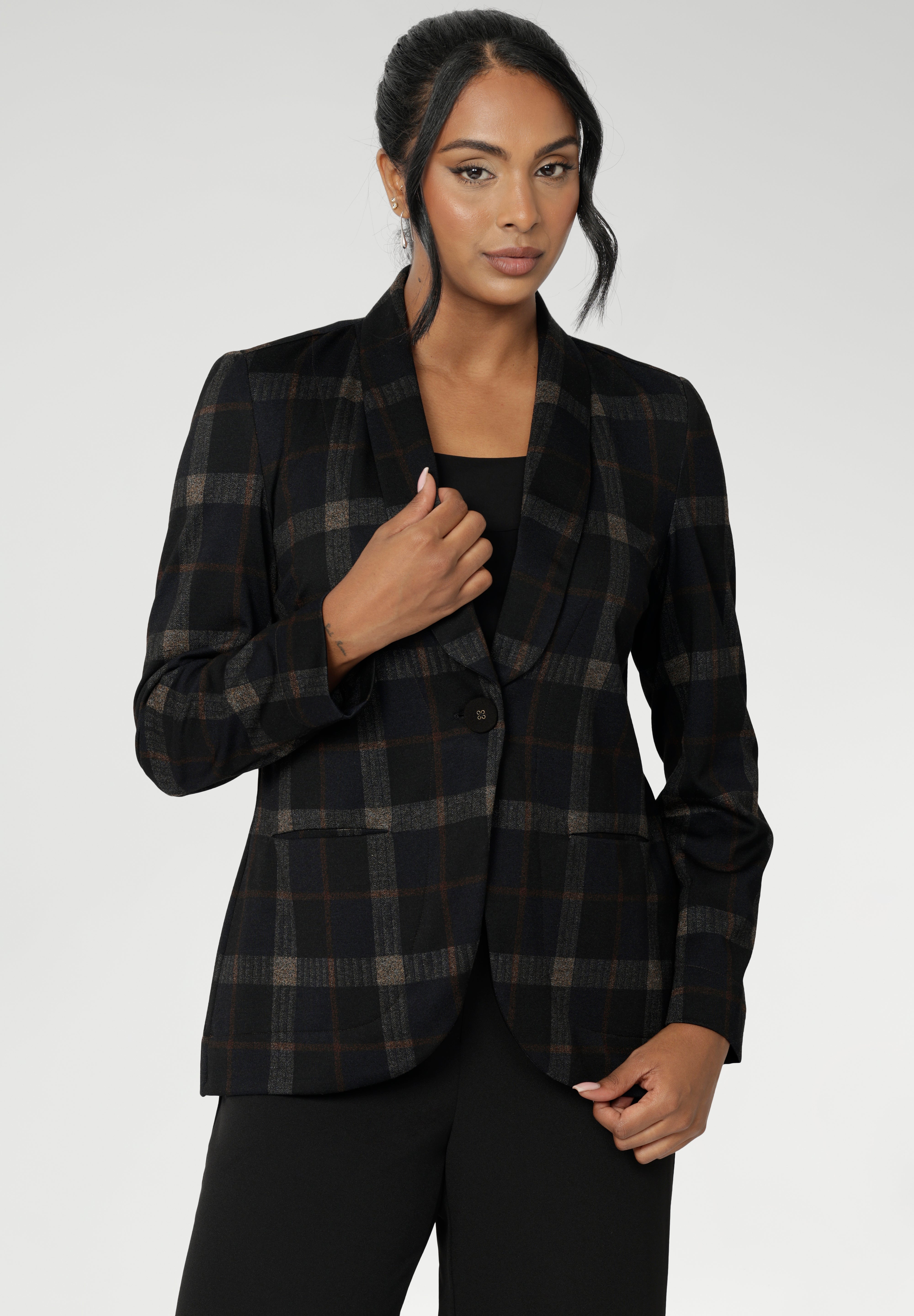 Designed with intention and polish, Merit features a clean button front, full-length sleeves with foldable cuffs, and an extended shawl collar that adds a soft, modern finish. This is a blazer that works hard—perfect for professional settings, but equally at home layered over casual pieces for a smart off-duty look.