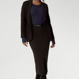 Light weight woman's workwear blazer that offers elevated style. Size 10 woman wears workwear blazer in cocoa colour, crafted from quality scuba crepe fabric. Worn with Bryn Top in Navy. Long blazer offers full body stretch and comfort. Australia made by Leina & Fleur in sizes 8-24.