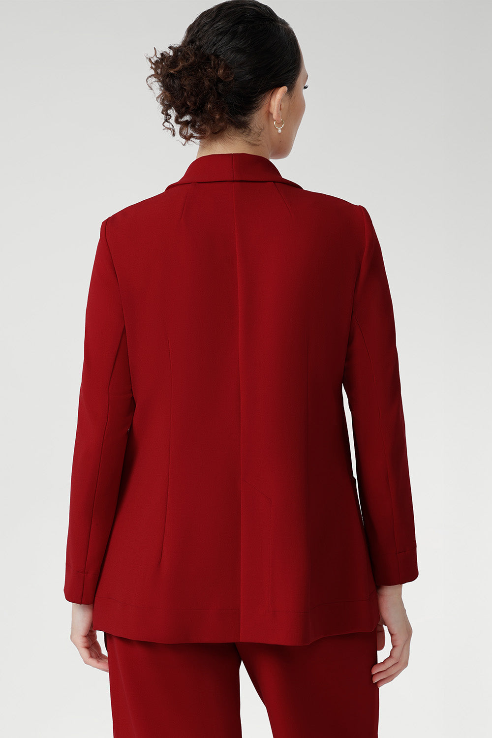 This red work blazer is worn with red workwear pants and red cami top. Curved hemline and front pockets. Made in Australia for women size 8 - 24.