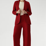 Bright red coloured blazer, a textured scuba crepe. Red work blazer is worn with black skirt and white t-shirt. Curved hemline and front pockets. This blazer is Made in Australia for petite women in sizes 8 - 24.