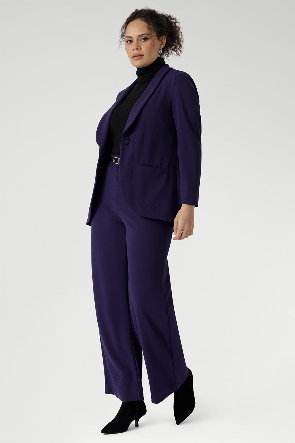 Redefine power dressing with the Merit Blazer, a modern classic crafted from our premium Scuba Crepe fabric for a sleek, structured fit with just the right amount of stretch. This expertly tailored jacket delivers timeless sophistication with a contemporary edge, featuring a sharp tuxedo-style shawl collar, a button-up front, and full-length sleeves with foldable cuffs for versatile styling. 