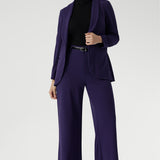 This expertly tailored jacket delivers timeless sophistication with a contemporary edge, featuring a sharp tuxedo-style shawl collar, a button-up front, and full-length sleeves with foldable cuffs for versatile styling. 