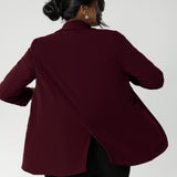 The back features a pleat, adding movement and structure to the overall look. The deep sleeve cuffs are designed to be turned up, offering an extra layer of style. Australian made by Leina & Fleur in sizes 8-24.