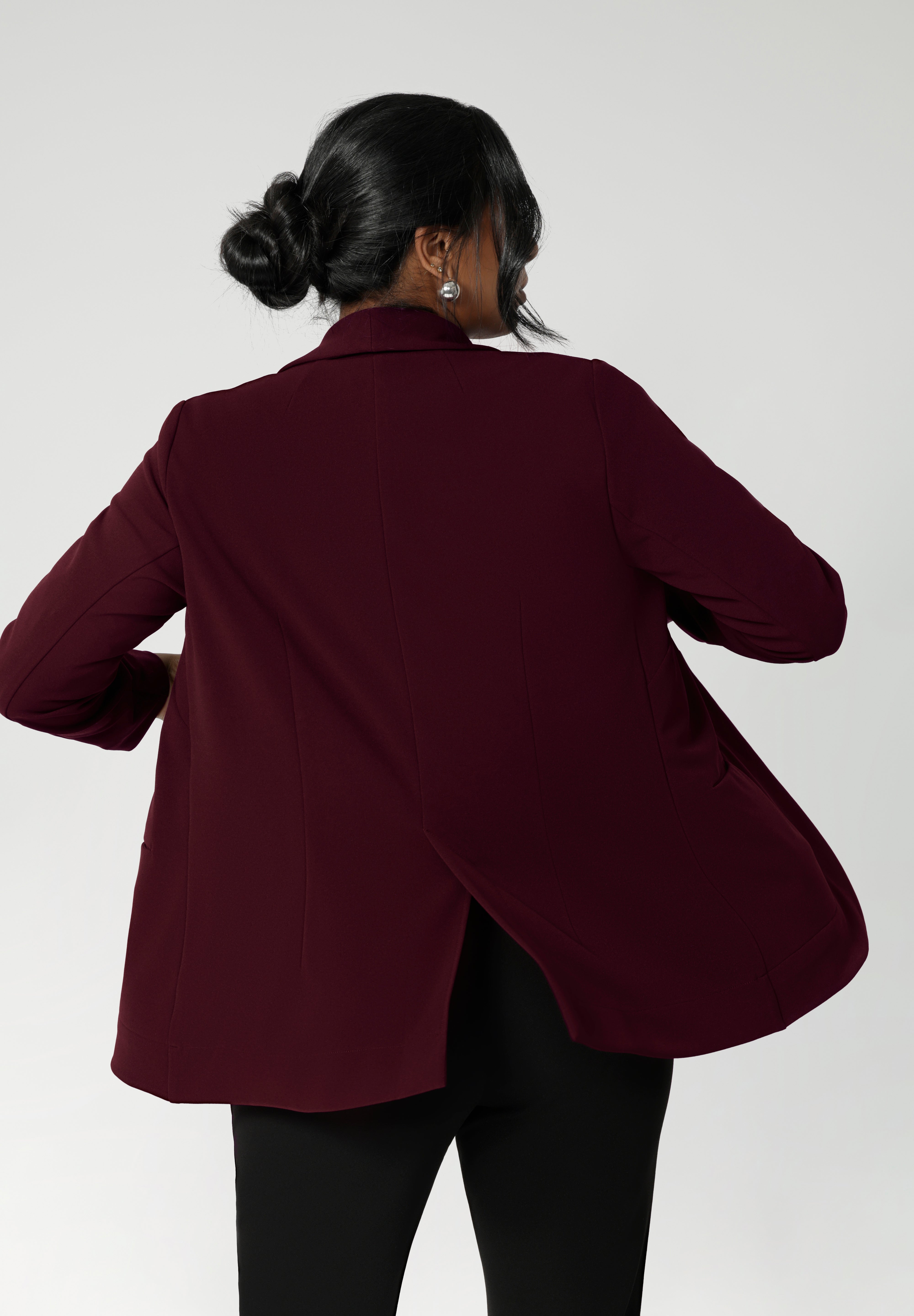 The back features a pleat, adding movement and structure to the overall look. The deep sleeve cuffs are designed to be turned up, offering an extra layer of style. Australian made by Leina & Fleur in sizes 8-24.