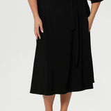 As part of the Made For You collection, each piece is crafted locally and available by pre-order, ensuring sustainable production and thoughtful design. Offered in a size-inclusive range from 8 to 24, this black wrap dress is tailored to complement every shape and style.