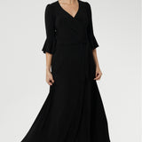 Offered in a size-inclusive range from 8 to 24, this black wrap dress is tailored to complement every shape and style. With a choice of a classic 3/4 sleeve, a soft fluted sleeve, or a dramatic bishop sleeve—along with your ideal length, available in both midi and maxi options.