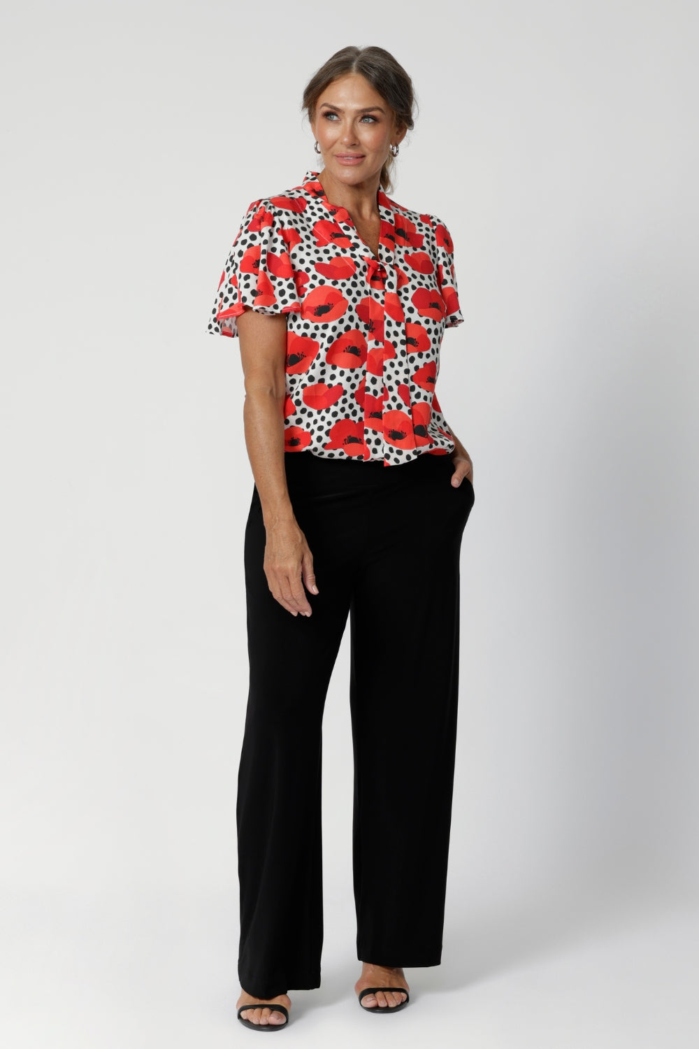 Whether you're heading to the office or out for a weekend brunch, this top offers a stylish solution for both settings. Australian-made workwear top is available in sizes 8-24. Crafted with care by Leina & Fleur. 