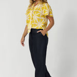 Size 12 model wears a perfectly suited top for a woman on the go, the shirt transitions effortlessly from work to after-hours events, offering both style and functionality. Proudly made in Australia, designed with Australian and New Zealand women in mind, and stocked in a wide range of sizes from 8 to 24 to ensure a perfect fit for every woman. 