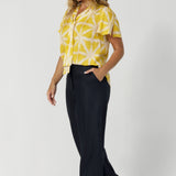 Size 12 model wears a perfectly suited top for a woman on the go, the shirt transitions effortlessly from work to after-hours events, offering both style and functionality. Proudly made in Australia, designed with Australian and New Zealand women in mind, and stocked in a wide range of sizes from 8 to 24 to ensure a perfect fit for every woman. 