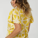 Designed for versatility and ease, this shirt is ideal for a woman who lead a busy lifestyle, transitioning effortlessly from the office to after-work activities. Made in Australia, it showcases attention to detail and quality craftsmanship, ensuring durability and style. Made for woman in sizes 8-24.