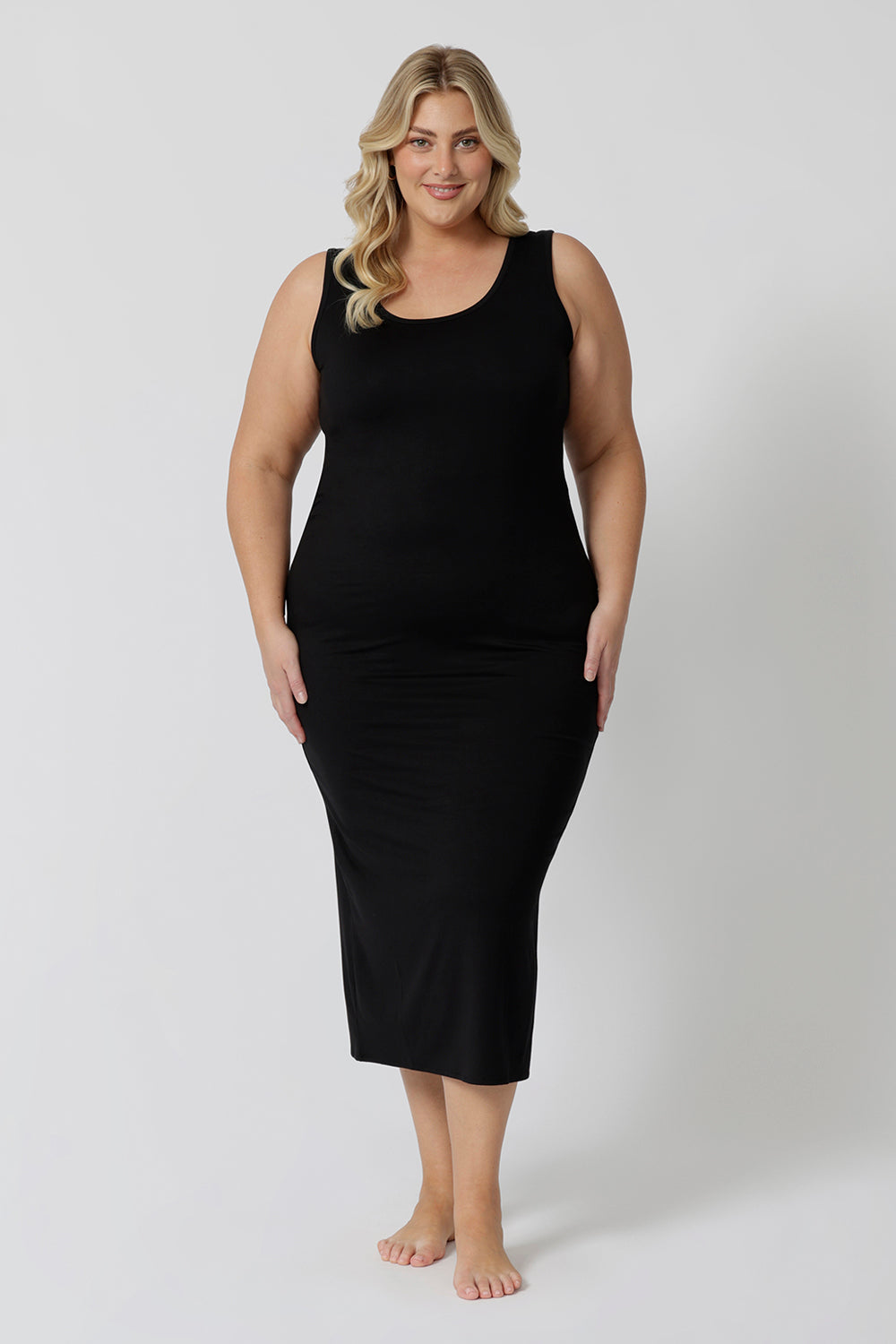 A midi dress that works as a nightdress and as loungewear. Shown on a size 18 woman, this slim-fit, plus size midi-dress in bamboo jersey is breathable and thermo-regulating. A good dress for night sweats and hot flushes, wear this as a summer dress for warm summer days. Shop nightdresses online in sizes 8 to 24 at L&F Australia.