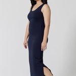 Side view of a navy blue lounge dress that works as a nightdress and as loungewear. Shown for petite women, this slim-fit, plus size midi-dress in navy blue bamboo jersey is breathable and thermo-regulating. A good dress for night sweats and hot flushes, wear this as a summer dress for warm summer days. Shop nightdresses in women's clothes label, L&F's new loungewear and sleepwear range online in sizes 8 to 24.