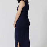 Back view of a  midi dress that works as a nightdress and as loungewear. Shown for petite women, this slim-fit midi-dress in navy blue bamboo jersey is breathable and thermo-regulating. A good dress for night sweats and hot flushes, wear this as a summer dress for warm summer days. Shop nightdresses in women's clothes brand, L&F's new loungewear and sleepwear range online in sizes 8 to 24.