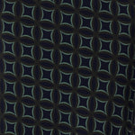 The Midnight Mosaic print is crafted on a dry touch jersey base in Navy, with geometric details in shades of green and grey. The fabric has a soft stretch. Image swatch of Midnight Mosaic print used to create Australian made woman's workwear clothing.