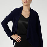 Softly tailored with a refined waterfall collar and an open front design, Mikey offers a polished, jacket-like silhouette that effortlessly carries you from the workday into evening events.