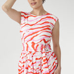 The vibrant abstract print combines pink and red tones on a soft vanilla base, bringing playful energy to warm days. Finished with a coordinating belt to define the waist. Made in Australia with integrity.