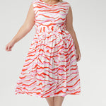 The vibrant abstract print combines pink and red tones on a soft vanilla base, bringing playful energy to warm days. Finished with a coordinating belt to define the waist. Made in Australia with integrity.