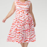 The vibrant abstract print combines pink and red tones on a soft vanilla base, bringing playful energy to warm days. Finished with a coordinating belt to define the waist. Made in Australia with integrity.