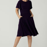 Monique dress in Amethyst. Jersey dress with flutter sleeve and rounded neckline. Full circle skirt and pockets. Made in Australia for women size 8 - 24.