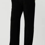 Close up of a tall woman curvy size 16 model wears Monroe Tall pants. Great work pants for tall women. Comfortable work pants in black jersey. Made in Australia size 8 - 24.