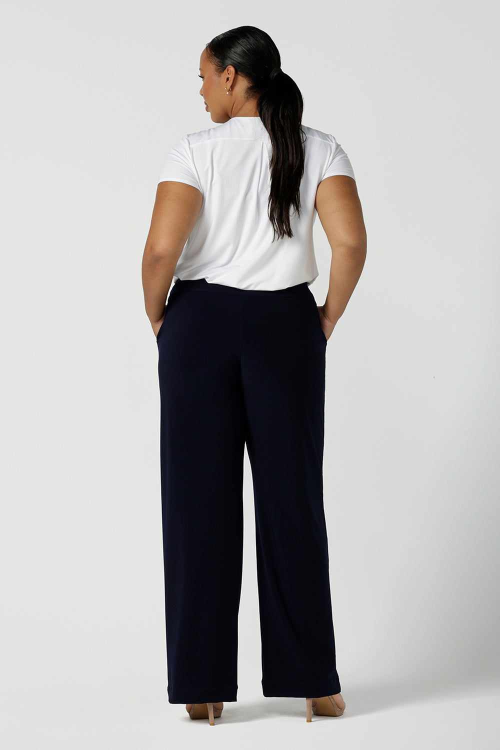 Back view of a tall woman curvy size 16 model wears Monroe Tall pants in navy. Great work pants for tall women. Comfortable work pants in navy jersey. Made in Australia size 8 - 24.