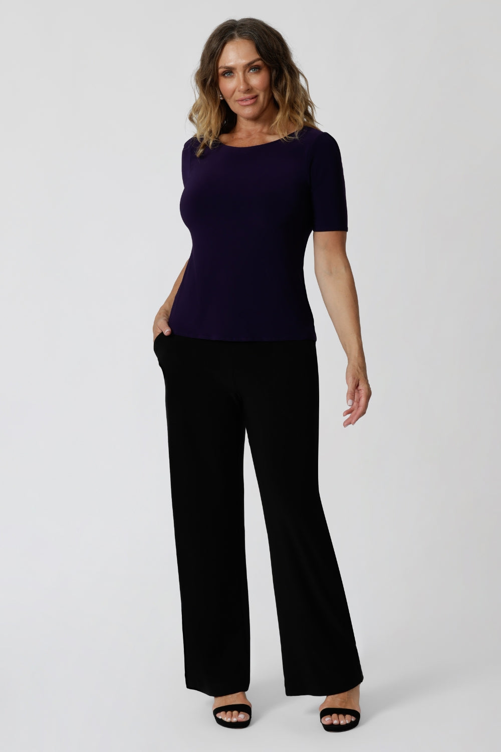 Women's size inclusive work pants. Pictured on a size 12 woman, these icomfortable black corporate pants. Full length straight leg pants with stretch shop in sizes 8-24