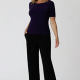 Women's size inclusive work pants. Pictured on a size 12 woman, these icomfortable black corporate pants. Full length straight leg pants with stretch shop in sizes 8-24