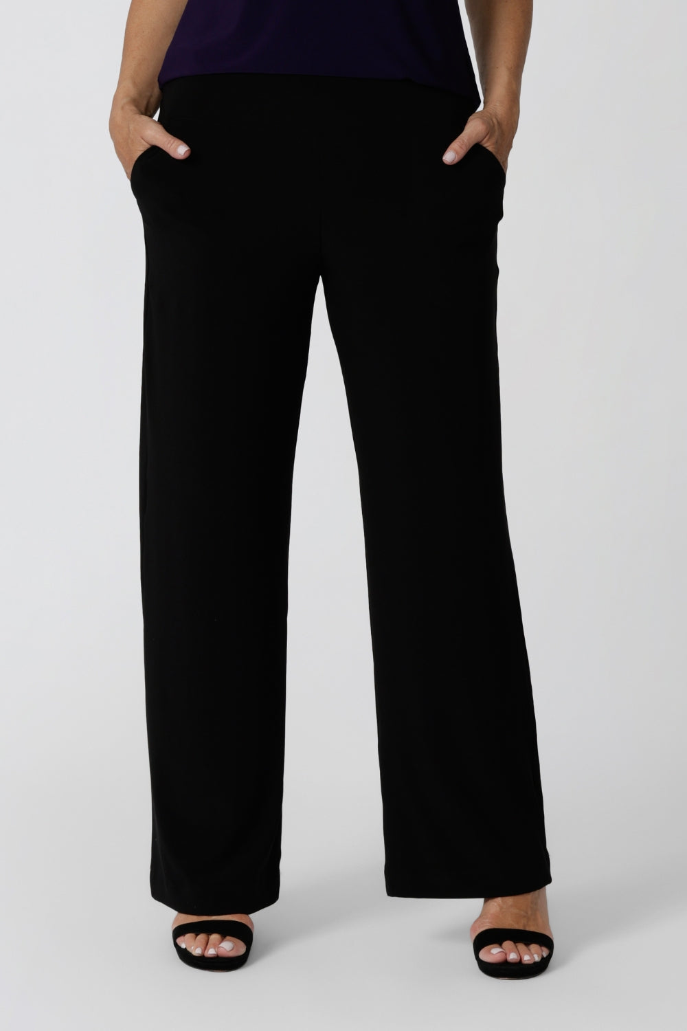 Women's size inclusive work pants. Pictured on a size 12 in black comfortable corporate pants. Full length straight leg pants