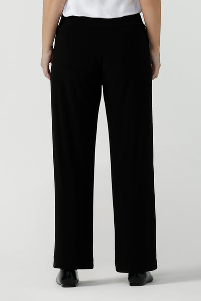 Close up image of womens size inclusive work pants. Pictured on a size 8 in black comfortable corporate pants. Full length straight leg pants
