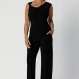 Black workwear pants have a pull on style and a wide straight leg. Crafted with dry touch jersey fabric in Australia for the woman on the go. Shop online at Australian women's fashion brand Leina & Fleur in a variety of sizes from 8-24. Monroe Pant now available in 3 heights.