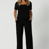 Over 40's woman wears back to work black pants in the long length version. Leina & Fleur's Monroe Pants feature a pull on easy style, with a full length straight leg. Made with easy care dry touch jersey fabric. Made in Australia for Australian & New Zealand women on the go. Leina & Fleur proudly stocks sizes from 8-24. The Monroe Pant is now available in 3 heights.