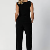 Back image of size 12 model in her 40's wearing back to work black pants. Monroe  Pants feature a pull on easy style, with a full length straight leg. Made with easy care, heavy weight, dry touch jersey fabric in Australia for the woman on the go. Shop Leina & Fleur core products in a variety of sizes from 8-24. The Monroe Pant now is available in 3 heights.