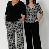 Available in two versatile colours and with the option of 3 pant lengths. Workwear essentials come in sizes 8-24. Providing comfortable yet stylish offering which is great fit for all body types. Image features plus size woman and petite height woman wearing the same short lengths pants in sizes 10 and 18.