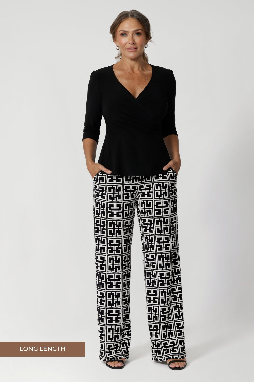 Black and white pants drape beautifully while providing all-day stretch and comfort. Made in Australia, the Monroe Pant combines versatility and sophistication, making them perfect for transitioning seamlessly from work to weekend. Size 12 model wears long length Monroe Pants in Olympia.