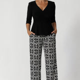 Black and white pants drape beautifully while providing all-day stretch and comfort. Made in Australia, the Monroe Pant combines versatility and sophistication, making them perfect for transitioning seamlessly from work to weekend. Size 12 model wears long length Monroe Pants in Olympia.