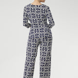 A timeless straight-leg pant designed to move effortlessly from the office to the weekend. Shown here, our size 10 model wears the Kyle Top in Ink Olympia paired with the matching Monroe Pant in Ink Olympia, styled together for a chic, printed jumpsuit effect. Available in sizes 8 to 24, with a choice of three leg lengths for the perfect fit.