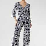 The classic straight-leg pant that transitions seamlessly from workwear to weekend. Size 10 model wears Kyle Top in Ink Olympia with matching Monroe Pant in Ink Olympia to create a printed jumpsuit set. Sizes 8-24 available and 3 leg lengths to choose from.