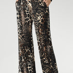 This pull-on style features a deep, double-layer waistband for added support and ease, along with side pockets enhanced by subtle topstitching for a polished finish.