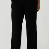 Close up of a tall woman curvy size 16 model wears Monroe Tall pants. Great work pants for tall women. Comfortable work pants in black jersey. Made in Australia size 8 - 24.