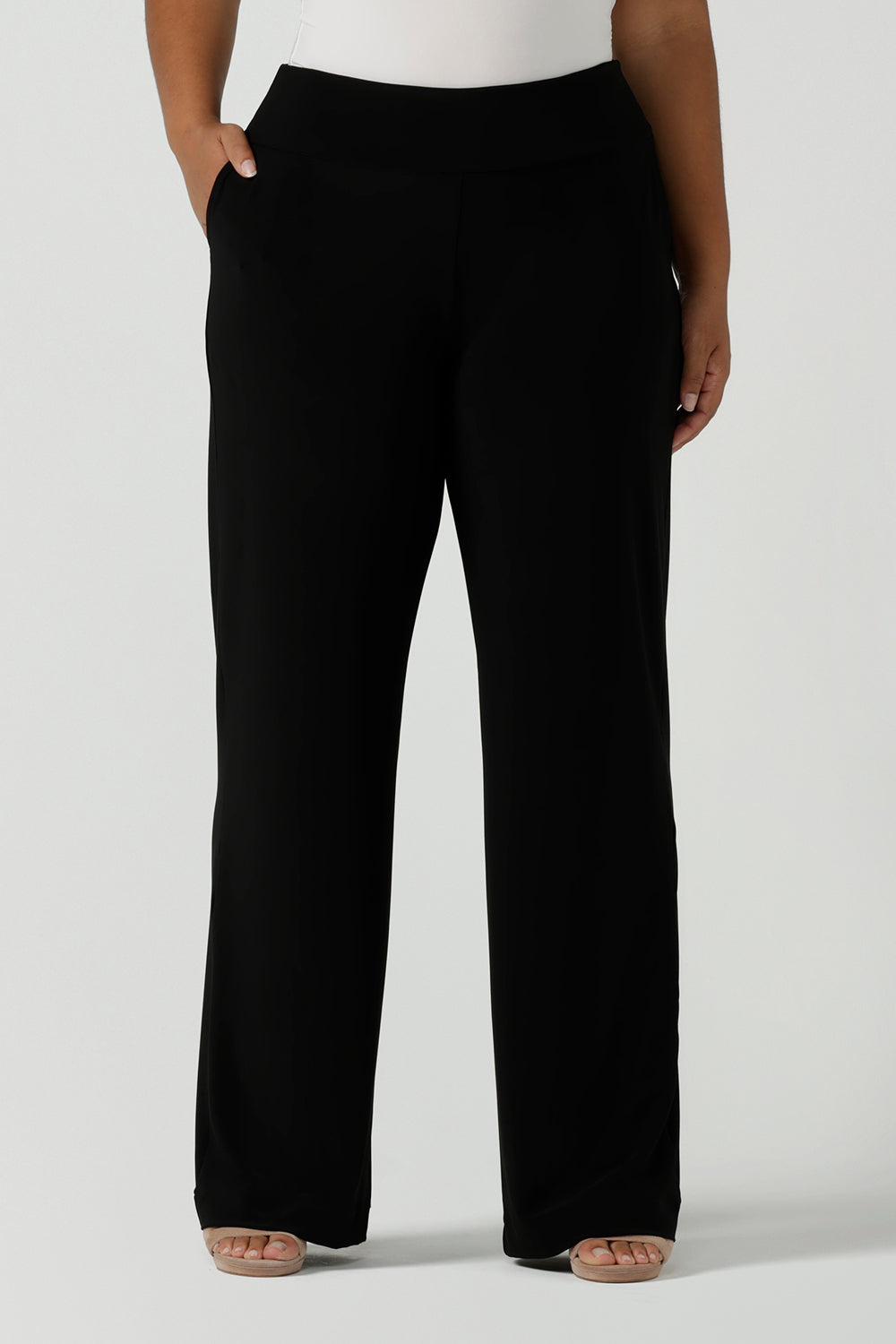 Close up of a tall woman curvy size 16 model wears Monroe Tall pants. Great work pants for tall women. Comfortable work pants in black jersey. Made in Australia size 8 - 24.