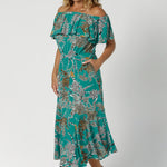 Side view of size 12 model wearing maxi dress that can be worn 3 ways, with side pockets and frill hem. Made in Australia for New Zealand and Australian Women. Shop size inclusive ranges by clothing brand Leina & Fleur in size 8-24.
