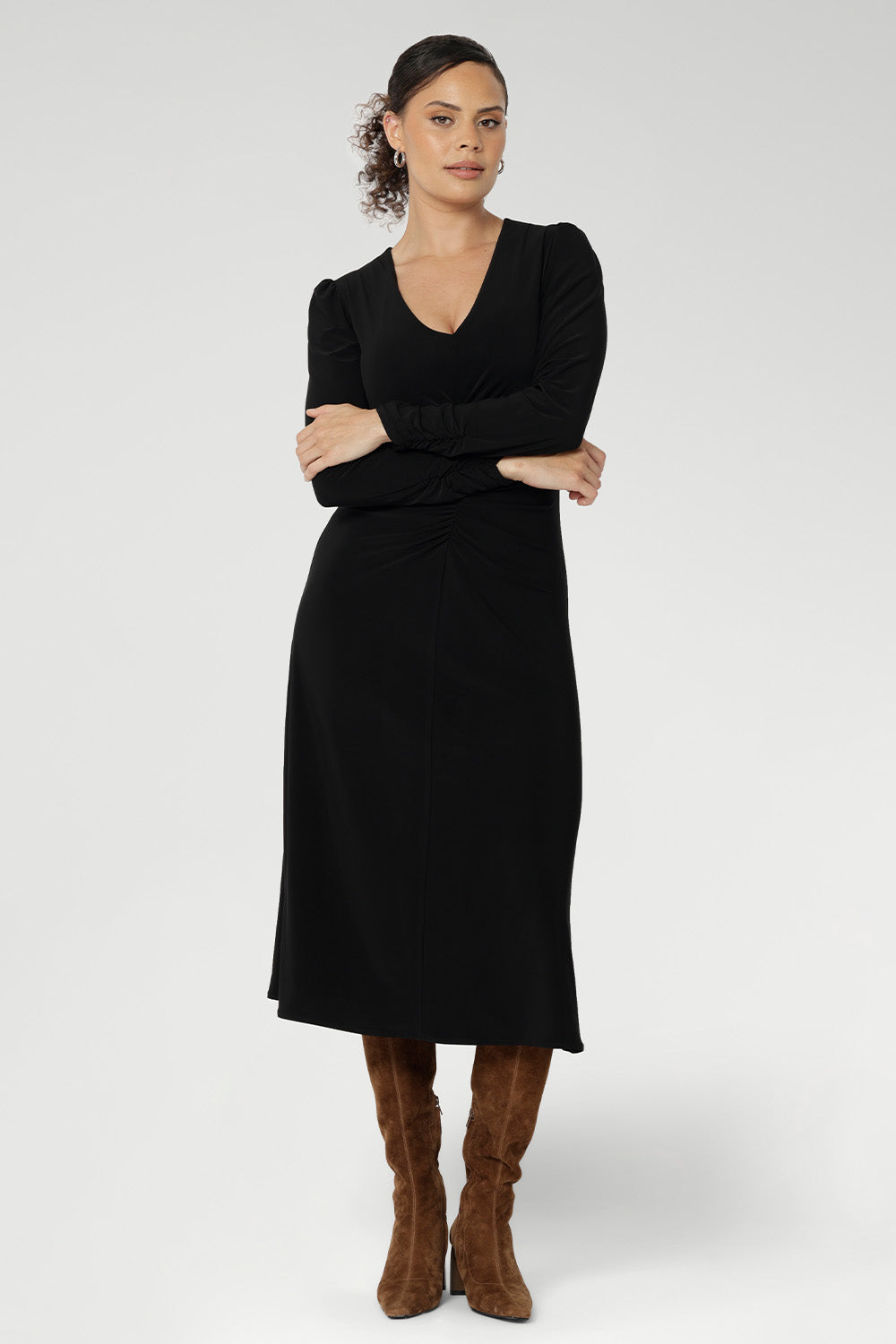 A flattering V-neckline, subtle gathering through the front and back, and shelf lining at the bust create a polished yet comfortable fit. Finishing just below the knee, the Nadine Dress is effortlessly elegant on its own or layered as the seasons change. Available in sizes 8–24.
