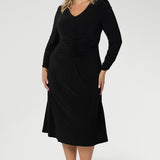 A flattering V-neckline, subtle gathering through the front and back, and shelf lining at the bust create a polished yet comfortable fit. Finishing just below the knee, the Nadine Dress is effortlessly elegant on its own or layered as the seasons change. Available in sizes 8–24.