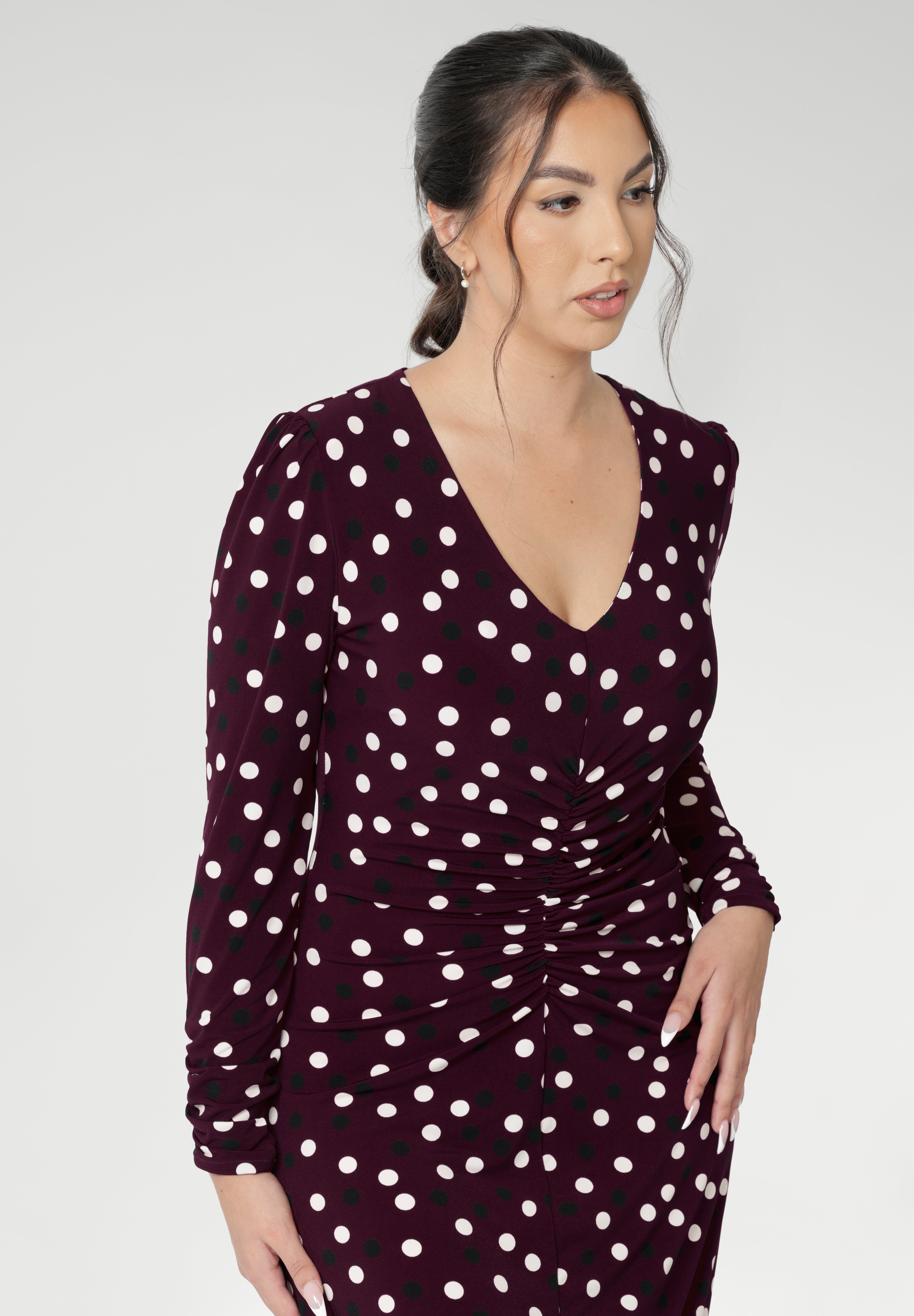 A classic V-neckline and full-length sleeves balance the design, making it perfect for cooler days or layered professional looks. Thoughtfully placed ruched detailing at the front, back, and along the sleeves adds gentle shaping and a touch of textural interest, while enhancing comfort and ease of movement. Available in size 8-24.
