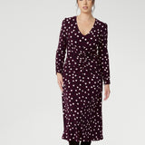 Petite height woman wears workwear dress with thoughtfully placed ruched details at the front, back, and along the sleeves. Crafted from Australian made dry touch jersey. 