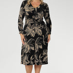 The V-neckline and gentle gathers at the front and back enhance the shape through the torso, while shelf lining through the bust ensures comfort and coverage. 